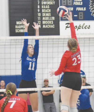Mallory Mueller (11) attempts to block St. Paul’s Emery Kennedy,\. Chuck Grafe/Tribune-Herald