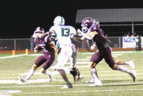 Preston Wagner tries to negotiate his way by Hempstead’s J’Leon Watts. Chuck Grafe/Tribune-Herald