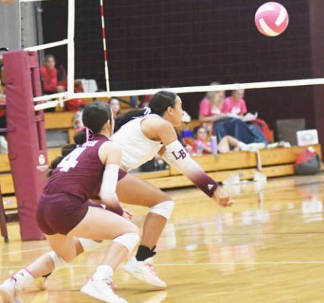 Kasey Harper digs one during the loss to Columbus. Chuck Grafe/Tribune-Herald