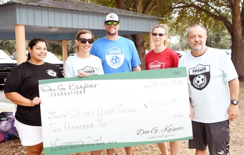 The Don G. Kaspar Foundation donated $2,000 to the Shiner Youth Soccer Association. From left are Agapita Espinosa, Hali Kaspar, Chris Colman, Angela Bays and Gabriel Espinosa. Photo by Mark Lube.