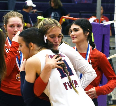 Dallyn Pesek embraces KFWA player Mariah Troxel after the TAPPS 2A South state semifinal on Thursday.  Photo by Mark Lube.