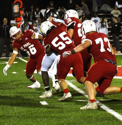 The St. Paul defense makes a team tackle against Fort Worth Temple Christian last Friday in Temple. Photo by Mark Lube.