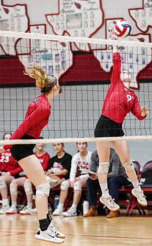 Samantha Moeller (right) makes a swing at the net during St. Paul area-round clash with Conroe Calvary Baptist on Nov. 11. She had four kills in the match. St. Paul played Katy Faith West Academy in the TAPPS 2A state semifinal at 1 p.m.  today at Waco University High School. Photo courtesy of Photos by Lori Raabe.