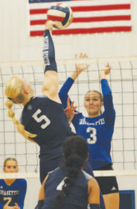 Layne Besetzny (3) goes up for a block. Chuck Grafe/ Tribune-Herald