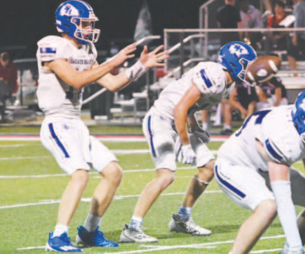 Quarterback Andrew Steffek takes a snap from center during the Temple Aiden Drozd (62) wraps up Columbus’ Bryan Salazar. Chuck Grafe/Tribune-Herald Central Texas game Friday. Photo credit Melissa Kutac