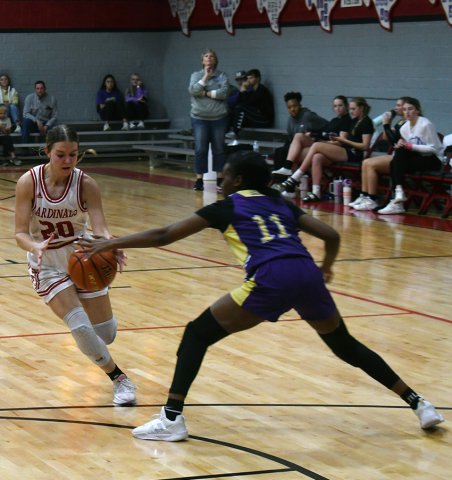 Shiner’s Jaliyah Barnett (right) tries to halt the advance of Lady Cardinal player Kristin Cerny during the game between the two Shiner schools Dec. 3. Photo by Mark Lube.