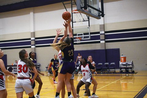 Kailey Boedeker takes a shot in the first half against Gloria Dea Academy on Thursday. She had 13 points in the game. Photo by Mark Lube.