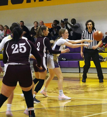 Kalle Kifer dishes the ball to a teammate during the first half against Flatonia. Photo by Mark Lube.