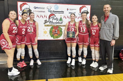 The St. Paul Lady Cardinals took first in the Feliz Navidad Prairie Lea Tournament. From left are Jenna Stock, Nora Koch, Kristin Cerny, Sloane Kocian, Reese Chilek, Annie Werner and head coach Max Bergkamp. Not shown are Riley Mozisek, Skylar Mozisek, Faith Brown, Addy Matias and assistant coach Nicco Brown. Photo courtesy of Courtney Kocian.