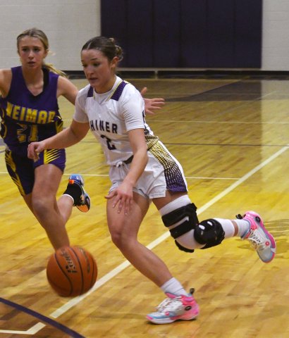 Callie Sevcik moves the ball inside the circle Friday against Weimar.  She tallied eight points.  Photo by Mark Lube.