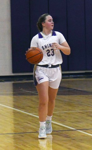 Kailey Boedeker moves the ball up court while searching for passing options. Photo by Mark Lube.