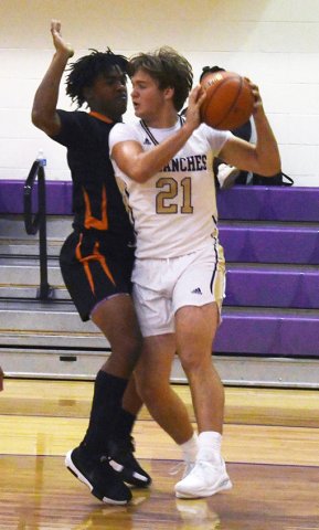 Jared Werner battles for a better position in Shiner’s game at home to Schulenburg on Friday. Photo by Mark Lube.