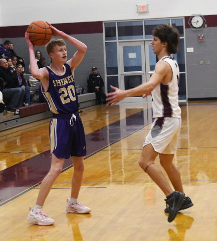 Reese Carson looks for an outlook as a Flatonia player covers him. Photo by Mark Lube.