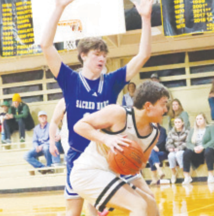 Kolby Haas guards RTC’s Cash Robertson. Chuck Grafe/Tribune-Herald