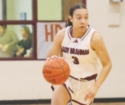 Kasey Harper looks down court durning District 25-AAA game against Edna. Chuck Grafe/Tribune-Herald