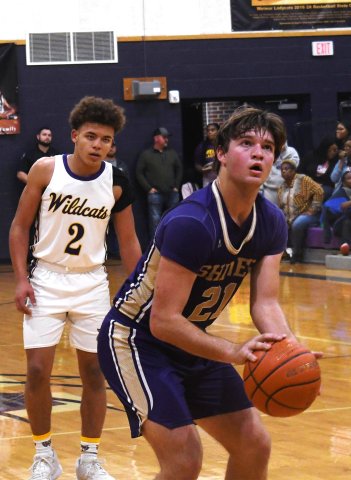 Jared Werner prepares to shoot a free throw in the first half of the Weimar game.  Photo by Mark Lube.