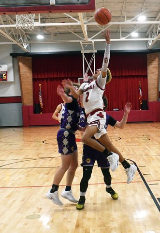 Ezekiel Rodriguez battles for a basket against Waldorf. He was St. Paul’s top scorer with 16 points. Photo by Mark Lube.