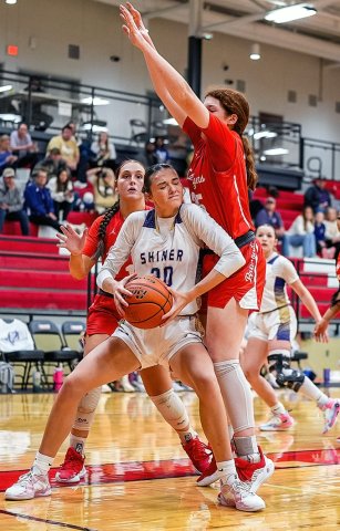 Shiner’s Morgan Lenehan did her best to gain leverage against a Bremond defender in their area playoff game in Manor on Thursday. Photo courtesy of Howard Esse.