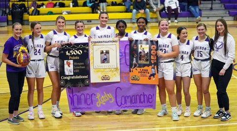 Morgan Lenehan (fifth from left) officially scored her 1,500th point as a Lady Comanche during the Ganado game on Friday. Also shown from left are teammates Harper Lenehan, Kallee Kifer, Addy Siegel, Callie Sevcik, Jaliyah Barnett, JaMya Wright, Kailey Boedeker, Marie Johnson, Hailey Radicke and Harlee Sevcik. Photo courtesy of Photos by Lori Raabe.