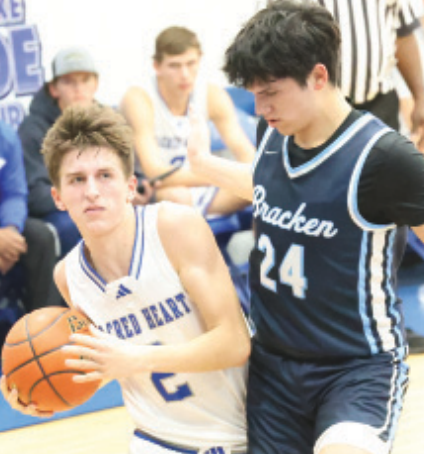 Hudson Kutac, left, in the Bracken Christian game. Chuck Grafe/Tribune-Herald
