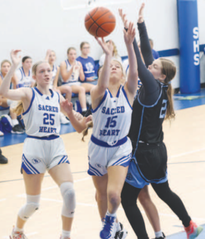 Allie Clark (15) rebounds. Chuck Grafe/Tribune-Herald