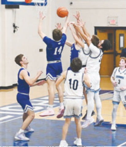 Kolby Haas (14) grabs a rebound. Melissa Kutac for the Tribune-Herald