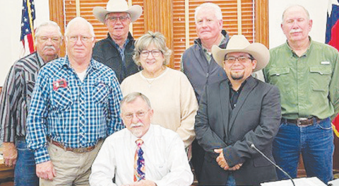 DeWitt County Commissioners made a proclamation designating the first week of March as DeWitt County Youth Livestock Show Week. Pictured from left to right are Commissioners James Kaiser, James Pilchiek, Cuero Livestock Show President Greg Gossett, Cuero Livestock Show Homemaking Coordinator Denise Goebel, Judge Daryl Fowler, Cuero Livestock Show Secretary Anthony Netardus, and Commissioners Ryan Varela and Brian Carson. Photo by Clayton Kelley.