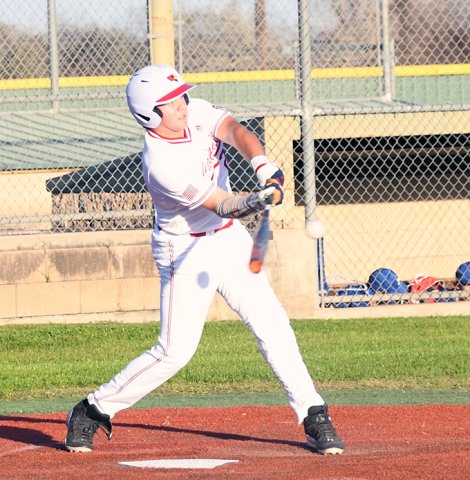St. Paul’s Joe Peters makes contact at the plate March 11 against Sacred Heart in the second inning. He had a fifth-inning double. Photo by Mark Lube.