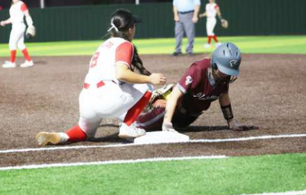 Taylor Yeatts dives safely back to first on a pick-off attempt in the Columbus game. Chuck Grafe/Tribune-Herald