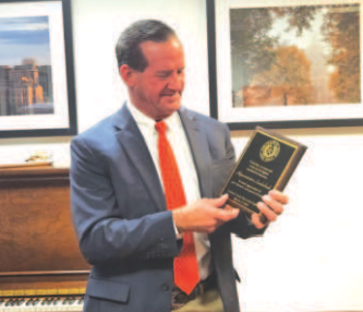 District 30 state representative A.J. Louderback displays plaque presented to him at the Lavaca County Day at the Capitol from the county