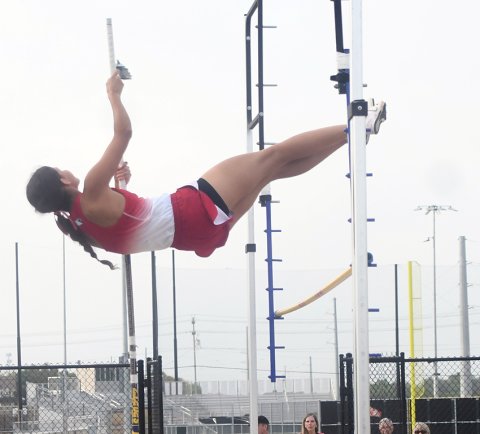 Nora Koch clears the bar during an attempt in the pole vault. She placed third and will compete at state on Friday (tomorrow). Photo by Mark Lube.
