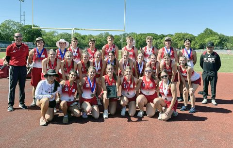 The St. Paul girls and boys track team, along with coaches Max Bergkamp, Nicco Brown and Corey Anzaldua  gather for a photo after the district meet April 7 at San Antonio Antonian College Prep. The girls got first place and the boys took second. Photo courtesy of St. Paul Booster Club.