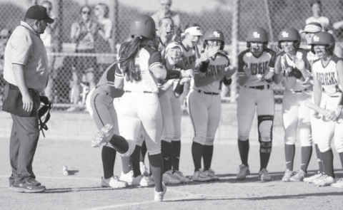 Ella Demel is greeted at home plate after hitting her sixth home run of the season against St. Paul Thursday. Mark Lube/Shiner Gazette