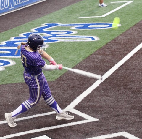 Kailey Boedeker hits a second-inning, two-run homer against Milano on Thursday. Reagan Fluitt added two home runs as Shiner clinched the regional-semifinal title with a 13-11 win. Photo by Mark Lube.