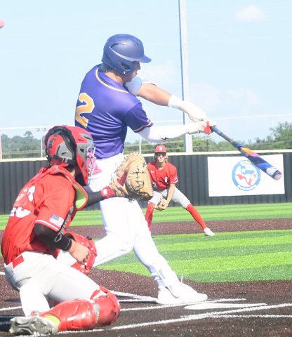 Bode Werner takes a swing at a pitch during action in the first game. Photo by Mark Lube. 