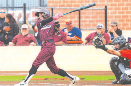 Brock Bludau watches his home run sail over the left field fence in the 2-1 Game 1 victory. Photo by Chuck Grafe