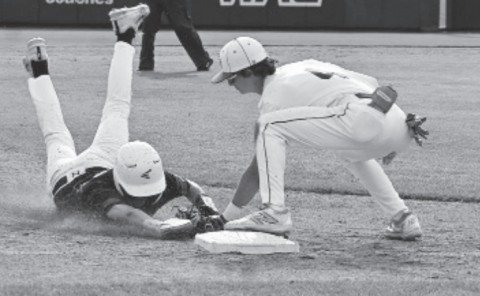 Third baseman Dillon Goedrich tags out a runner in the semifinal game Thursday. Photo by Melissa Kutac