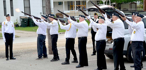 Color guard members of the Lavaca Memorial Veterans of Foreign Wars Post 6382 and the Vietnam Veterans of America Lone Star Chapter 854 conduct a 21-gun salute to conclude Memorial Day ceremonies held at the Sacred Heart Family Center this past Monday. Photo by Jimmy Appelt