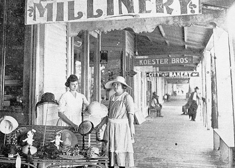 From the book Moulton, Texas 1887-1987. The photo includes the following information: Millinery Shop (about 1920). Pictured are Leona Janszen, owner (left), and employee, Hilda Krause. The establishment was destroyed in the 1921 fire.