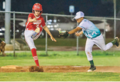 Photo by Nicole Smith/Luling Newsboy Brantley Steffek avoids the tag in the victory over Luling.