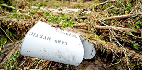 A Camp Mystic mailbox is seen near the entrance to the establishment along the banks of the Guadalupe River after a flash flood swept through the area Saturday, July 5, 2025, in Hunt, Texas. (AP Photo/Julio Cortez)