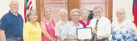 The DeWitt County Historical Commission received a Distinguished Service Award certificate at the DeWitt County Commissioners Court meeting July 14. Pictured from left to right are Historical Commission members Dan Williams, Mary Sue Williams, Shanna Burge, Marjie Kacir, Peggy Ledbetter, Betty Burda, DeWitt County Judge Daryl Fowler, and Historical Commission member Barbara Fogelle.