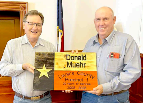 Lavaca County Pct. 1 road and maintenance employee Donald Muehr was presented a retirement plaque at the Monday morning Commissioners’ Court meeting. Muehr is retiring after 20 years of service to the county. Presenting the plaque is Pct. 1 commissioner Edward Pustka (left). Photo by Jimmy Appelt