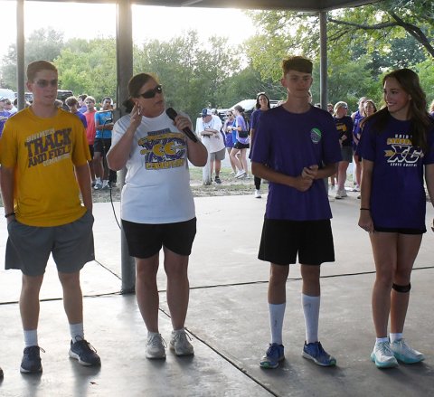 Shiner head cross-country coach Michelle Winkenwerder (center) makes some remarks about the cross-country team Monday evening at ‘Meet The Comanches’. Photo by Mark Lube.