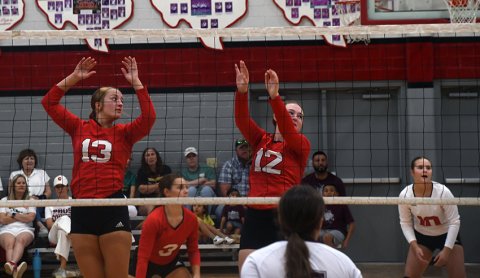 St. Paul JV players from left, Rebecca Brown and August Dodson, get ready at the net Aug. 19 at home to Flatonia. Photo by Mark Lube.