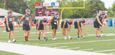 Photo by Chuck Grafe The Brahmas stretch before the Monday evening workout.