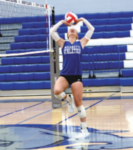 Photo by Chuck Grafe Kenzie Chance sets during the scrimmage in Yoakum Friday..