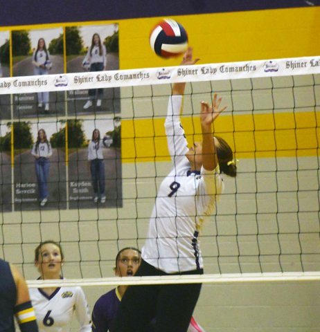 Lexi Boner strikes the ball near the net in Friday’s home match against Poth. She had seven kills. Photo by Mark Lube.