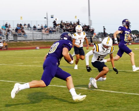 Tight end Charlie Clifford faces down a Poth defender after making a first-quarter reception in Shiner’s 41-19 win over the Pirates on Friday at Comanche Stadium. Photo by Mark Lube.