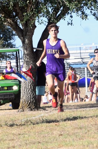 Logan Benavidez is at the top of the hill close to the finish line. He placed No. 20 in the varsity boys 1A-2A. Photo by Mark Lube.